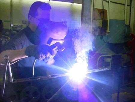 Man welding engine part